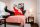 The Governor in a furnished bedroom
